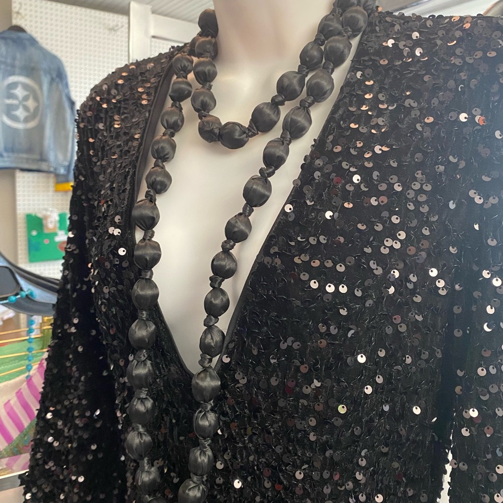 Rhinestone Jumpsuit w/ black beaded necklace bell bottom flare.
